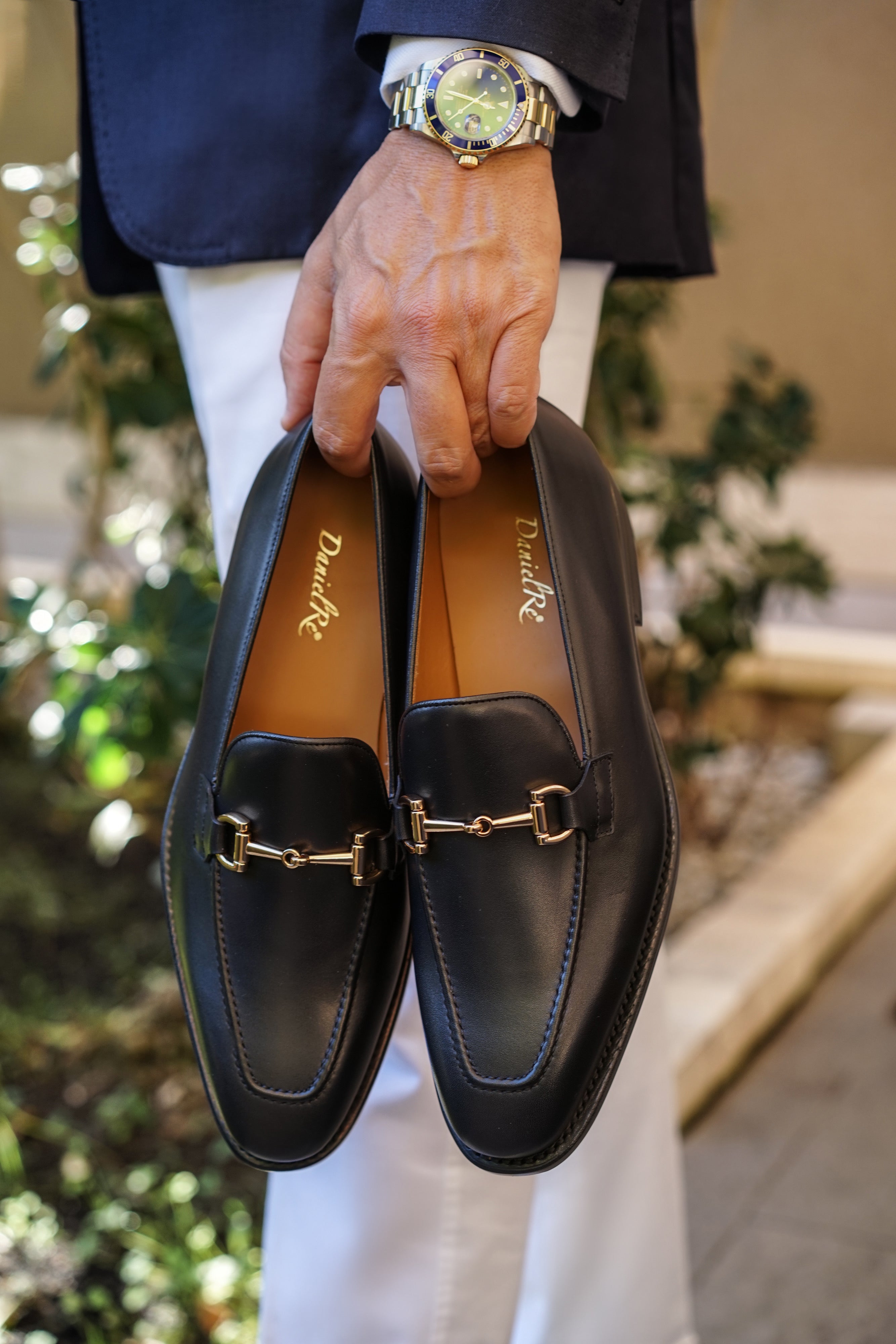 Black loafers with store gold